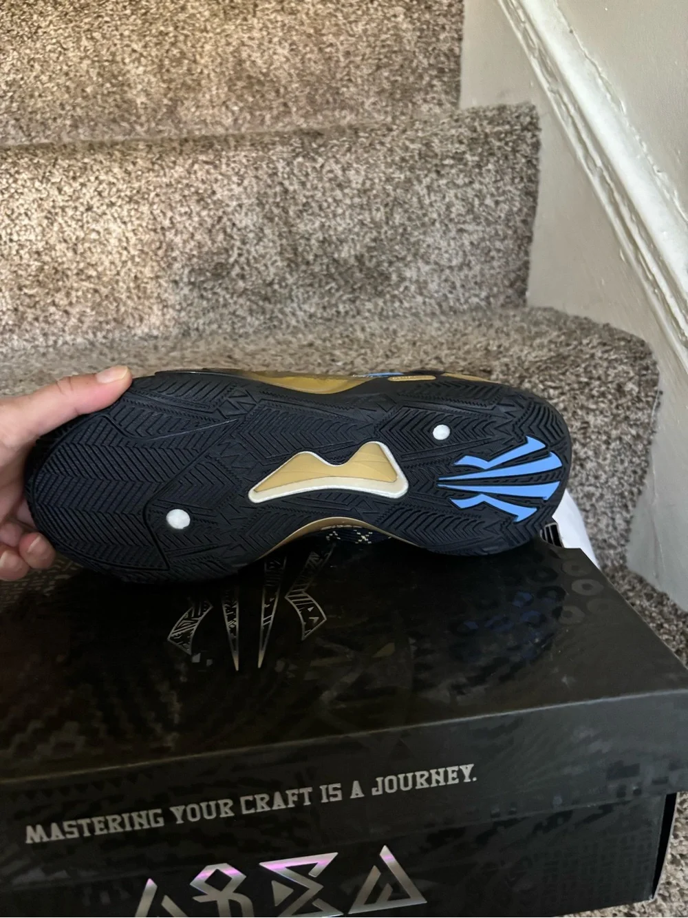 Black & Gold Athletic Sneaker with Blue Accents